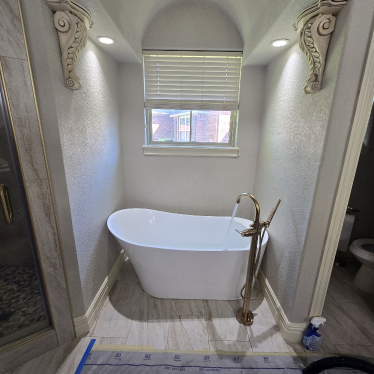 bath tub installation and bathroom remodeling due to water damage by Bear Restoration in NWA